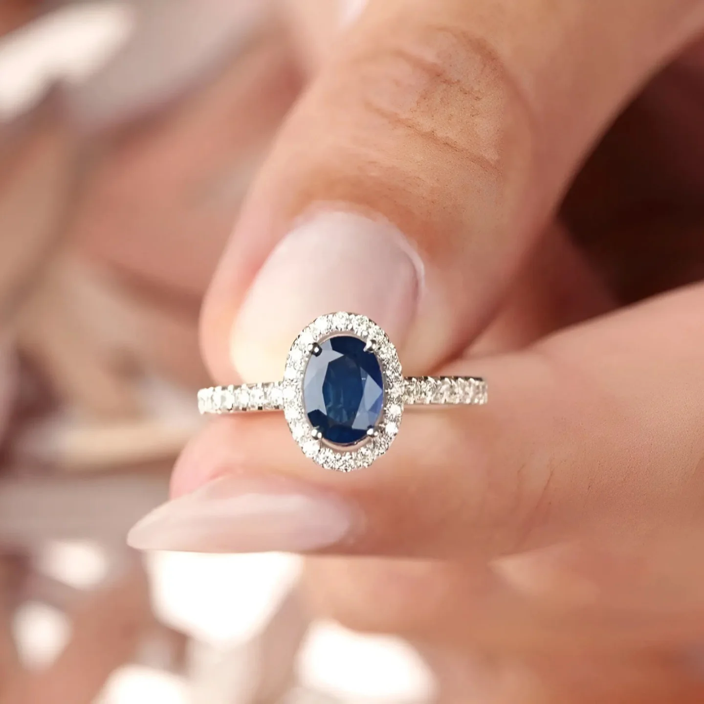 Miro Jewelers White Gold Oval Blue Topaz Ring with Diamond Halo